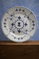 K&Co. presents: 
Royal 
Copenhagen Blue 
Fluted Plain 
dinner plate in 
iron porcelain 
with logo from 
the navy...