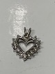 Antik Huset 
presents: 
Pendant 14 
carat white 
gold, shaped 
like a, Heart
with inlaid 
Diamonds.