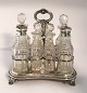 Lundin Antique 
presents: 
English 
sterling 
Platmenage with 
7 crystal 
decanters 
(925). Length 
19 cm. Height 
20 ...