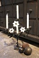 K&Co. presents: 
Antique, 
French 
candlestick in 
dark patinated 
bronze, 
decorated with 
3 old white 
glass 
flowers...