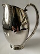Antik Huset 
presents: 
Silver jug 
&#8203;&#8203;Evald 
Nielsen 
hammered
Height. 17.5 
cm.