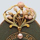 Antik 
Damgaard-
Lauritsen 
presents: 
An Art 
Nouveau brooch 
in 18k gold 
with enamel, 
diamonds and 
pearl