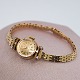 Antik 
Damgaard-
Lauritsen 
presents: 
Rolex; 
Orchid watch in 
18k gold with 
diamonds, with 
chain in 14k 
gold