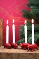 K&Co. presents: 
Old 
Christmas pigs 
in painted 
porcelain 
with space for 
a small 
Christmas 
candle...