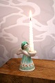 K&Co. presents: 
L. Hjorth 
ceramic angel 
with rare green 
glaze holding a 
small candle. 
Height: 9cm.