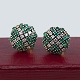 Antik 
Damgaard-
Lauritsen 
presents: 
A pair of 
round earrings 
in 14kt gold 
set with 
diamonds and 
emeralds