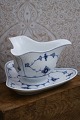 K&Co. presents: 
Royal 
Copenhagen Blue 
Fluted Plain 
triangular 
sauce pot on 
solid 
saucer.1/203. 
1898-1923...