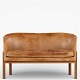 Roxy Klassik presents: Mogens Koch / Rud. Rasmussen Snedkerier.MK 52/2 - 2-seater sofa in patinated, ...
