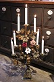 K&Co. presents: Antique French church candlestick in bronze with 2 fine colored porcelain flowers and 1 white ...