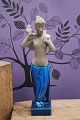 K&Co. presents: Johannes Hedegaard stoneware figurine of a girl with doves produced by Royal Copenhagen...