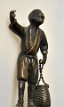 Pegasus – Kunst - Antik - Design presents: Chinese bronze figurine of a boy with a pot, 19th century.