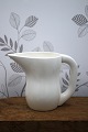 K&Co. presents: Original Ursula faience jug with handle from Royal Copenhagen in white glaze...