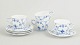 L'Art presents: Royal Copenhagen Blue Fluted Plain, set of four demitasse cups with matching saucers.