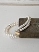 Karstens Antik presents: Two-strand cultured pearl bracelet with clasp in 18 kt gold