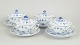 L'Art presents: Royal Copenhagen, Blue Fluted Plain set of four bouillon cups with saucers.