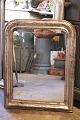 K&Co. presents: French 19th century Louis Philippe silver fireplace mirror with a finely decorated ...