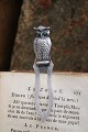 K&Co. presents: Old silver bookmark in the shape of a small owl with green glass eyes...