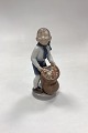 Danam Antik presents: Royal Copenhagen Monthly Figurine December - Boy with Christmas Sack No. 4534