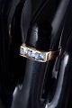 L'Art presents: 14 carat gold ring with light blue synthetic spinels.