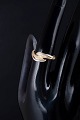 L'Art presents: 8 carat gold ring with four white stones.