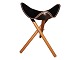 Antik K presents: StoolBlack leather and foldable wooden legs
