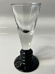 Antik Huset presents: Shot glass on black base,Height: cm. 10.7 cm.Designed by Jacob E Bang Holmegaard.