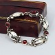 Antik Damgaard-Lauritsen presents: Georg Jensen; A "Moonlight Blossom" bracelet of sterling silver, set with ...