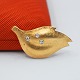 Antik Damgaard-Lauritsen presents: Ole Lynggaard; Brooch of 14k gold set with diamonds