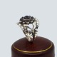 Antik Damgaard-Lauritsen presents: Georg Jensen; Moonlight Blossom ring of sterling silver with black agates, ...