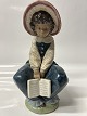 Antik Huset presents: Lladro, Spanish Figurine: Girl with Book.Height 21.5 cm.