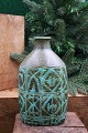 K&Co. presents: Kgl. oval faience Baca vase designed by Nils Thorsson from Aluminia with green / black pattern...