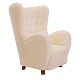 Aabenraa Antikvitetshandel presents: Upholstered high-back lounge chair appears with new sheepskin ...