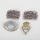 L'Art presents: Set of two belt buckles and two brooches.
