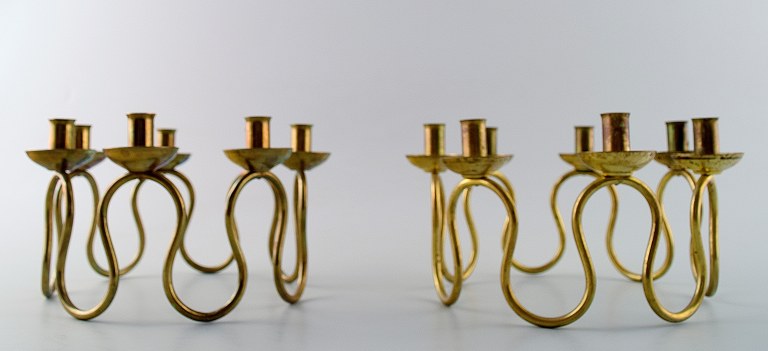 A pair of candlesticks, "Svensk tenn" "Arvika" Brass.