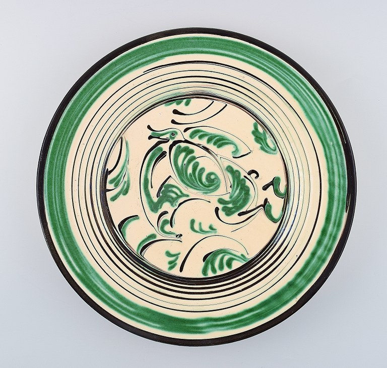 Kähler, HAK, glazed stoneware dish decorated with a duck.
