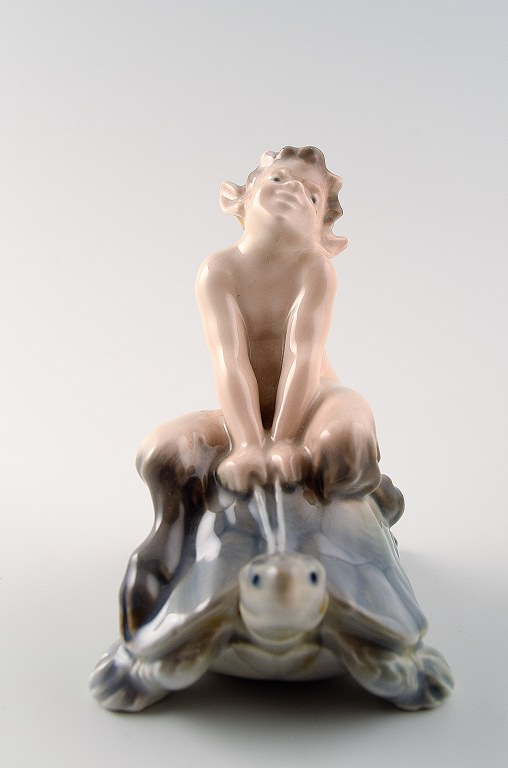 Royal Copenhagen Figurine Faun (Pan) on a turtle.

