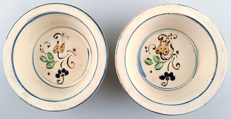 2 Kähler, Denmark, glazed bowls in pottery decorated with flowers.
