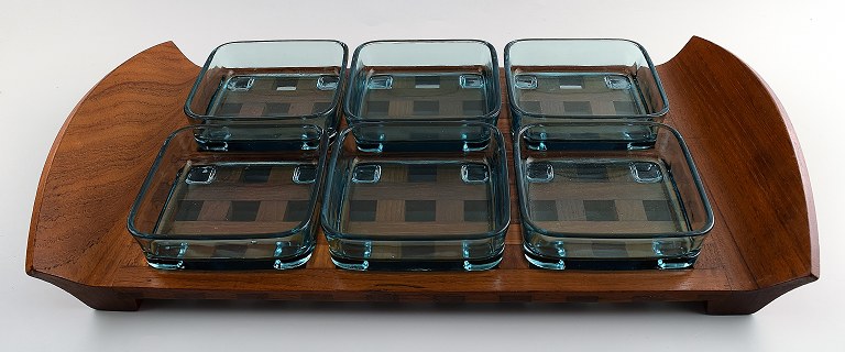 Jens Harald Quistgaard. Tray in teak with six containers in colored glass.