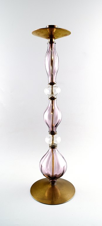 Erik Höglund, large floor candlestick in brass with hand-blown clear and purple 
glass art.