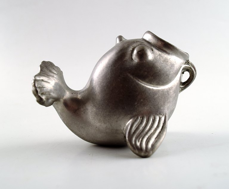 Figure of fish, designed by Just Andersen.
