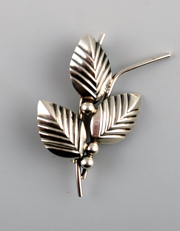 N.E.From sterling silver brooch.