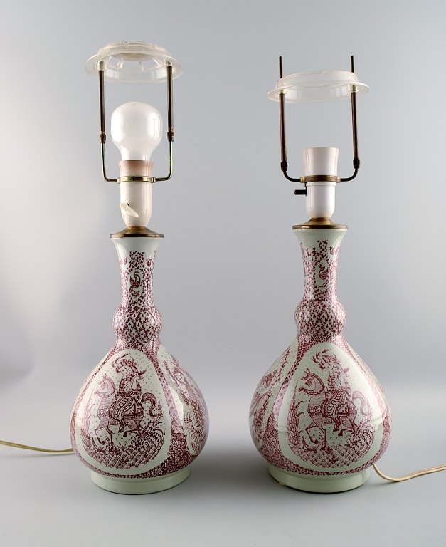 A pair of Bjørn Wiinblad, Nymølle table lamps in earthenware with 4 different 
motifs in red.