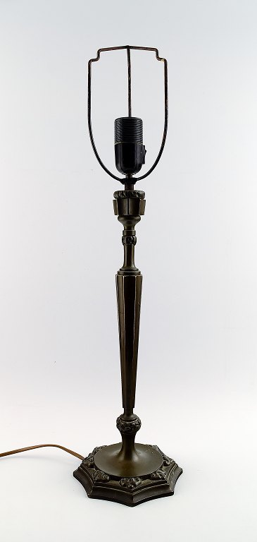 Thorvald Bindesbøll: b. Copenhagen 1846, d. 1908.
Table Lamp. Patinated bronze with art nouveau ornamentation in relief on 
eight-sided foot.