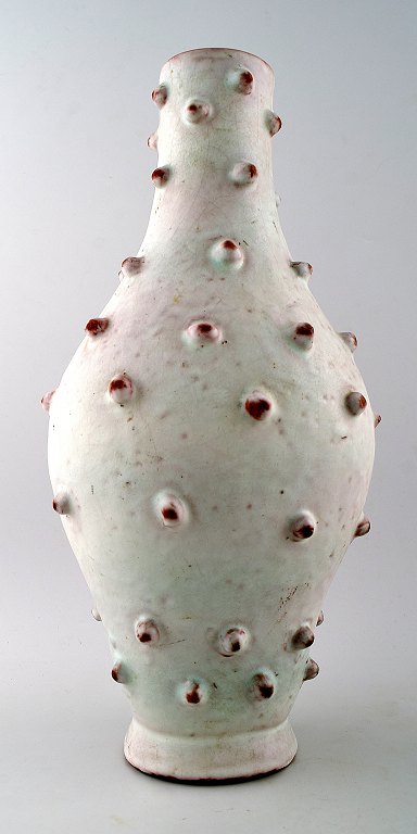 Large pottery vase in budded style.
