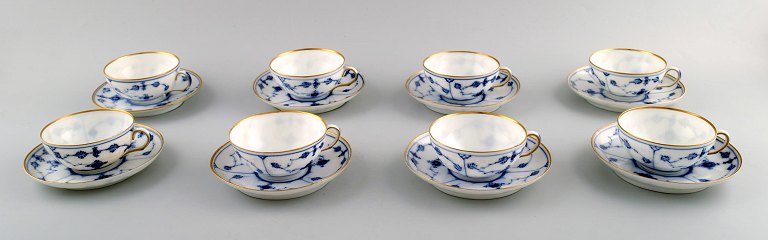 8 sets of Royal Copenhagen blue fluted mocha / doll cup with gold, including 
saucer.