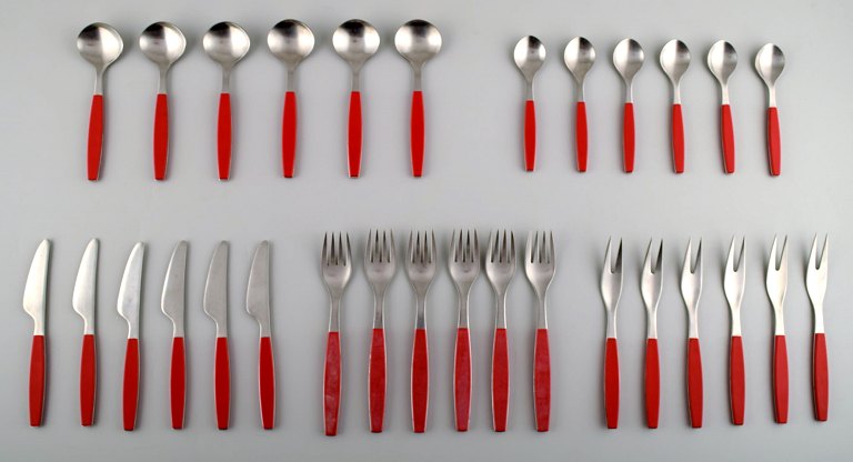Complete service for 6 p., Henning Koppel. Strata cutlery made of stainless 
steel and red plastic. Produced by Georg Jensen.