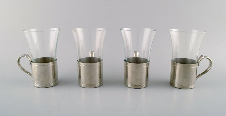 4 pcs of Just Andersen Art Deco pewter mugs with loose glass. Hunting set. 
Liquor set. Irish Coffee.  Denmark 1940 s.