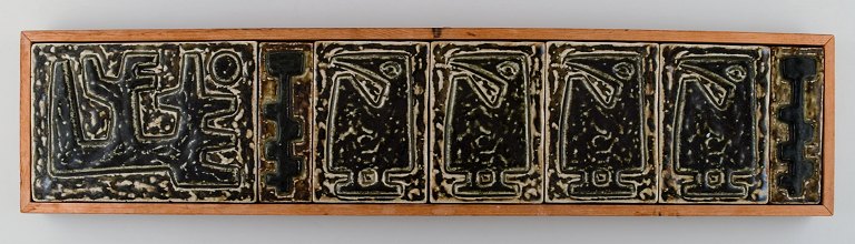 Jørgen Mogensen for Royal Copenhagen. Large wall plaque in the form of seven 
reliefs decorated with abstract motifs.