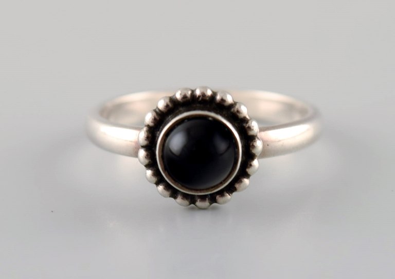 Ring in sterling silver by Georg Jensen, adorned with cabochon cut black agate.