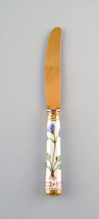 Michelsen for Royal Copenhagen. "Flora Danica" lunch knife of gold plated 
sterling silver. Porcelain handle decorated in colors and gold with flowers.